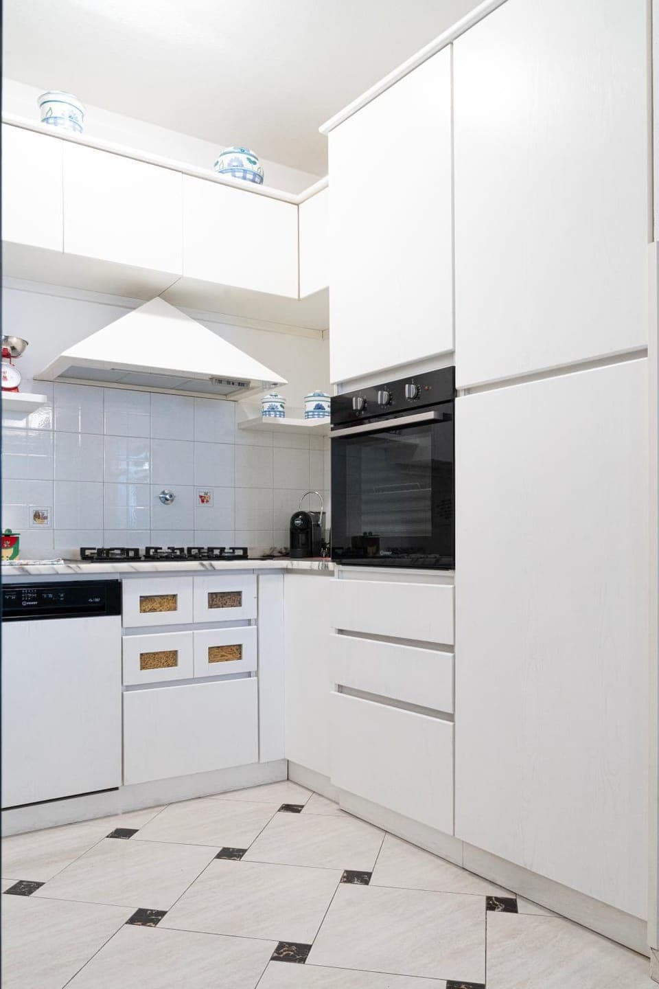 Kitchen or kitchenette, dishwasher, oven, stove