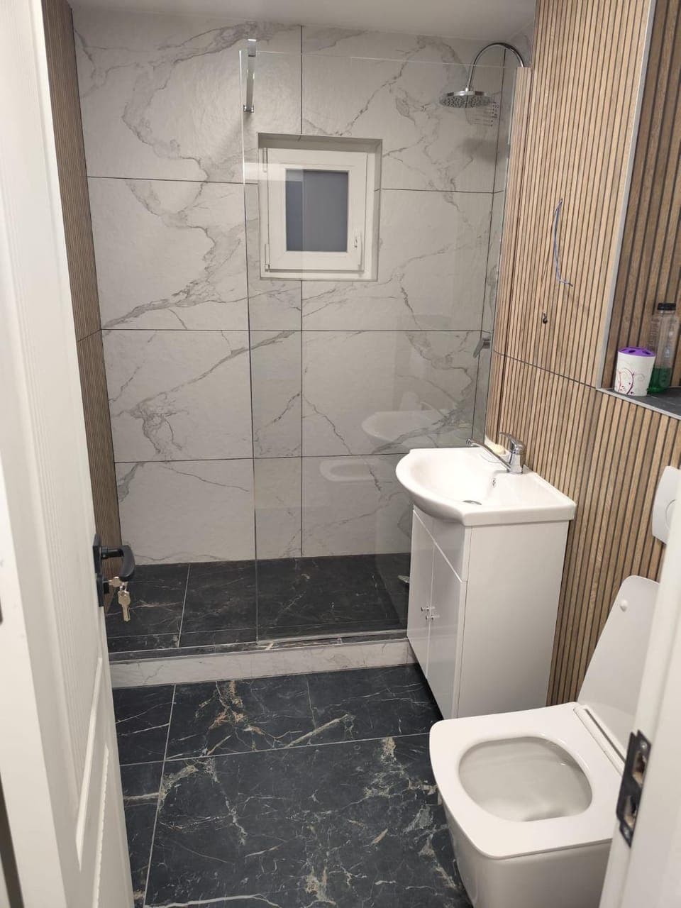 Shower, Toilet, Bathroom, hair dryier, towels