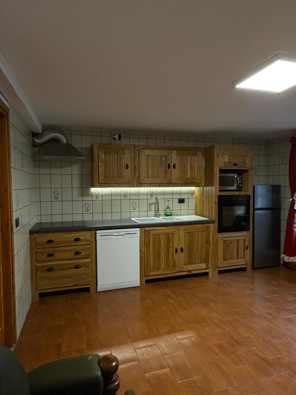 Kitchen or kitchenette, dishwasher, oven, stove