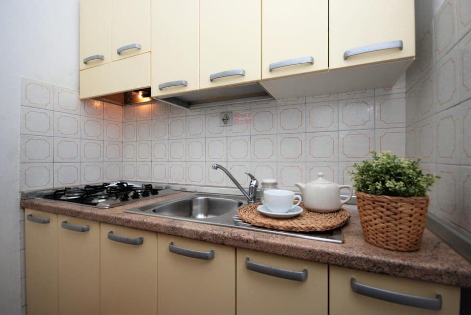 Kitchen or kitchenette, stove