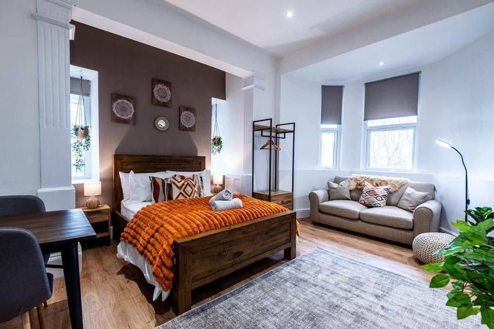 Bed, Living room, Seating area, Bedroom