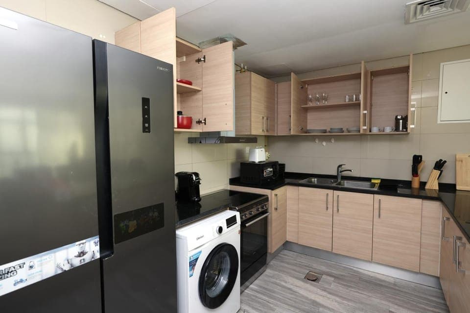Coffee/tea facilities, Kitchen or kitchenette, oven, stove, toaster, washing machine