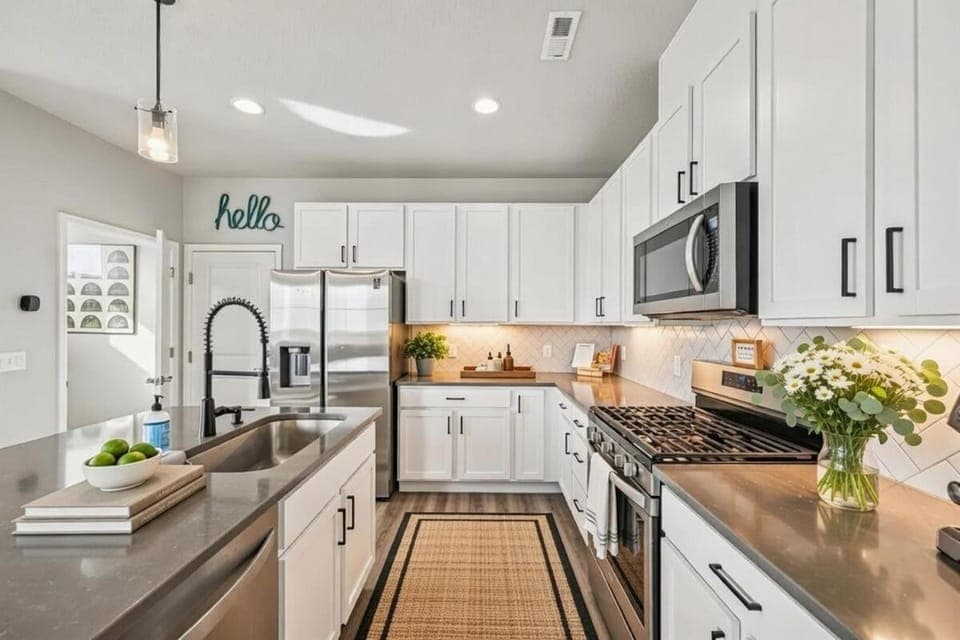 Kitchen or kitchenette, dishwasher, oven, stove, toaster