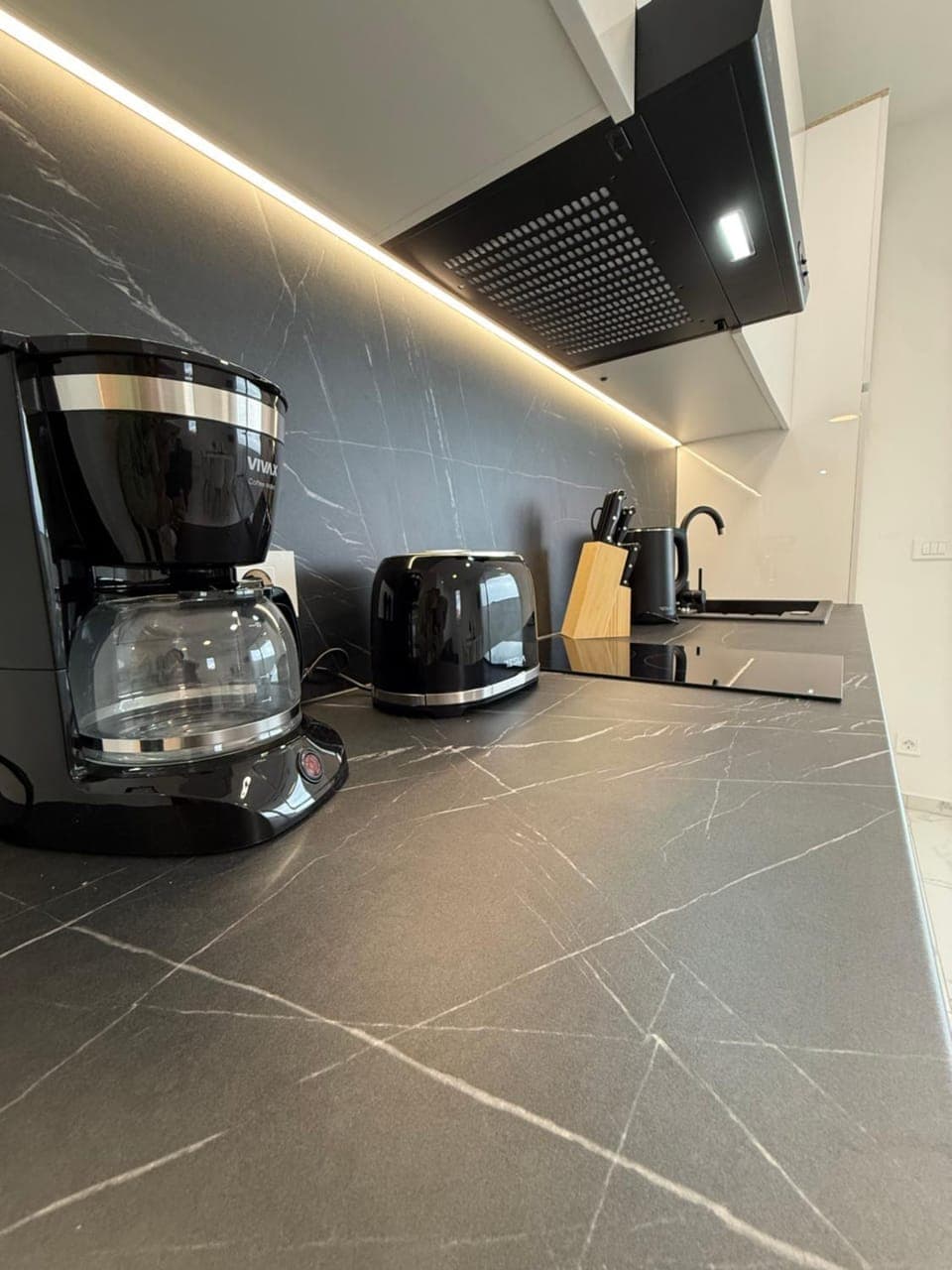 Kitchen or kitchenette, stove, toaster