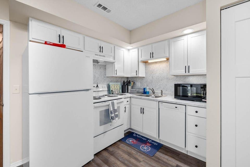 Kitchen or kitchenette, dishwasher, oven, stove, toaster