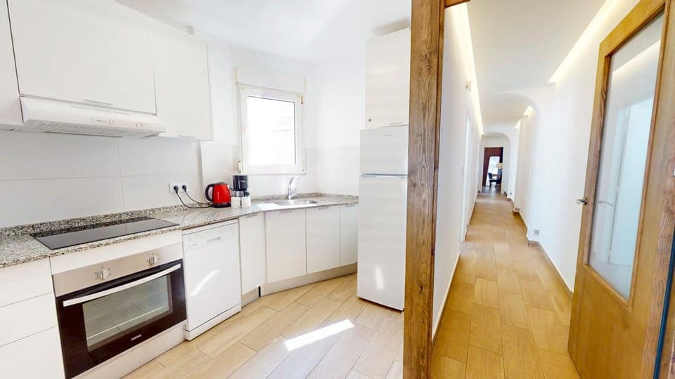 Kitchen or kitchenette, dishwasher, oven, stove