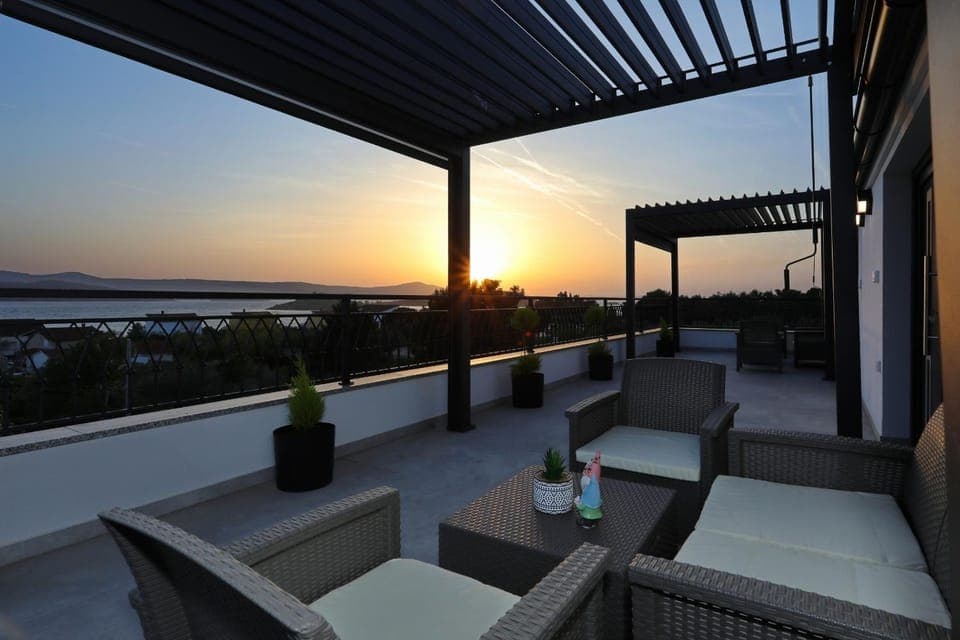 View (from property/room), Balcony/Terrace, Seating area, Sunset