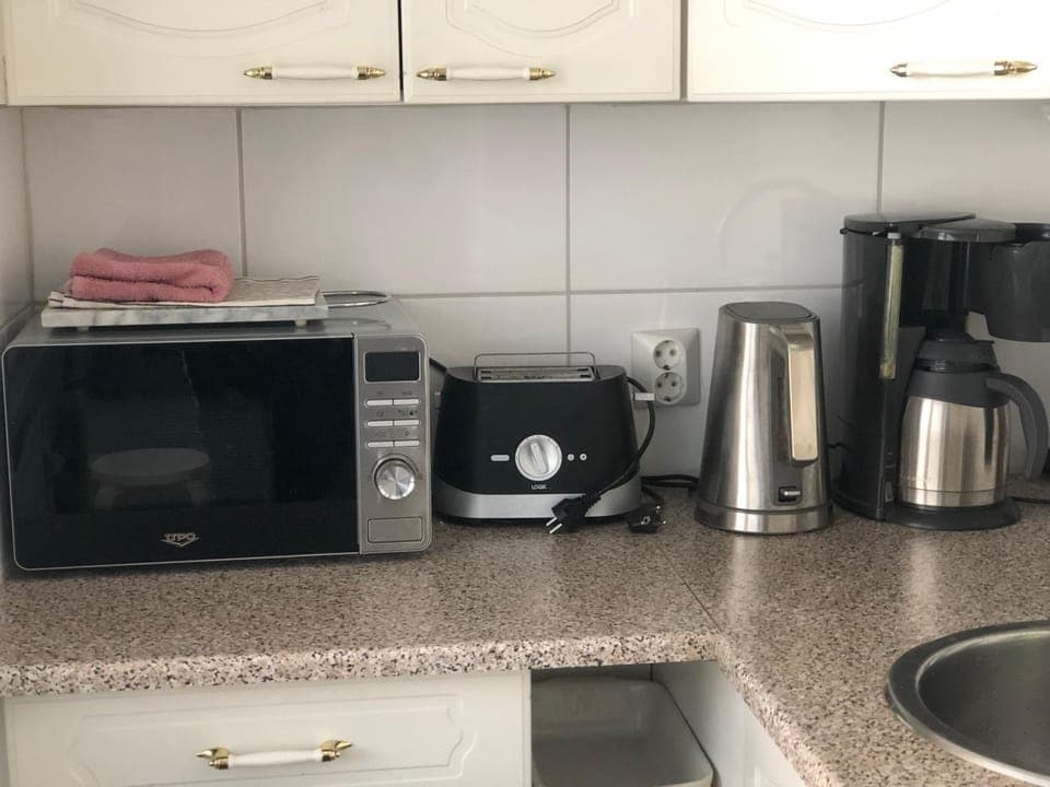 Kitchen or kitchenette, toaster