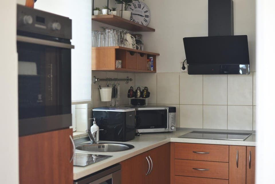 Kitchen or kitchenette, dishwasher, oven, stove