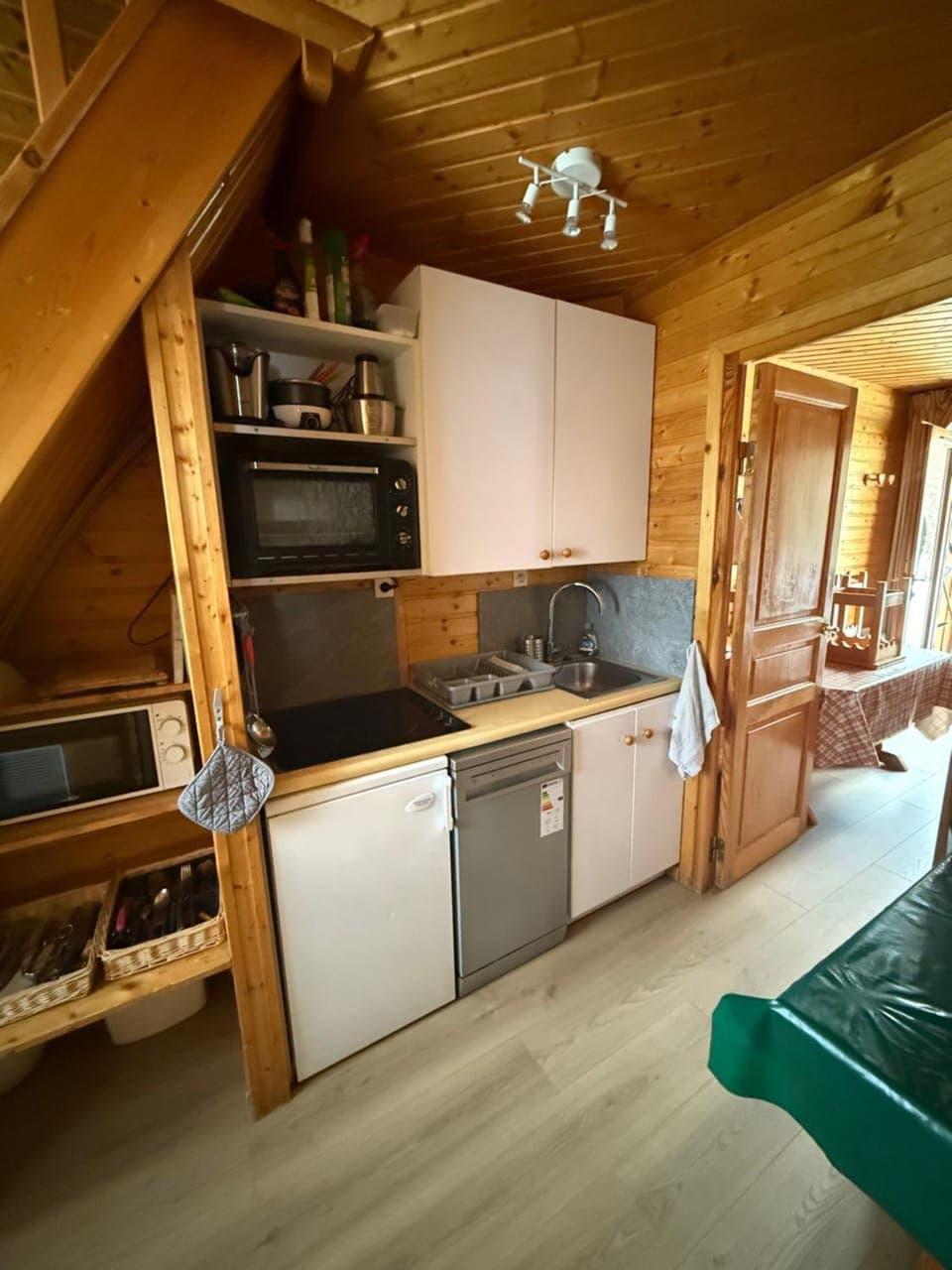 Kitchen or kitchenette, dishwasher, oven, stove