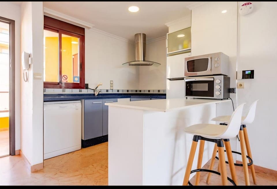 Kitchen or kitchenette, dishwasher, stove, toaster