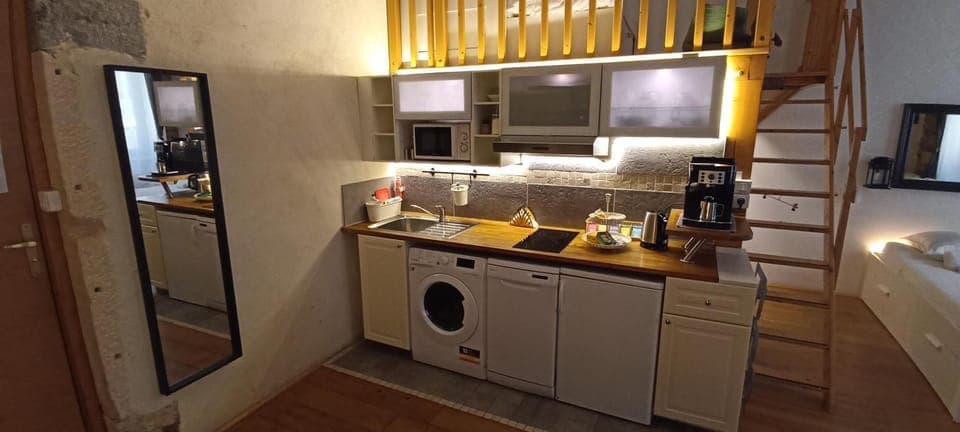 Kitchen or kitchenette, dishwasher, oven, stove