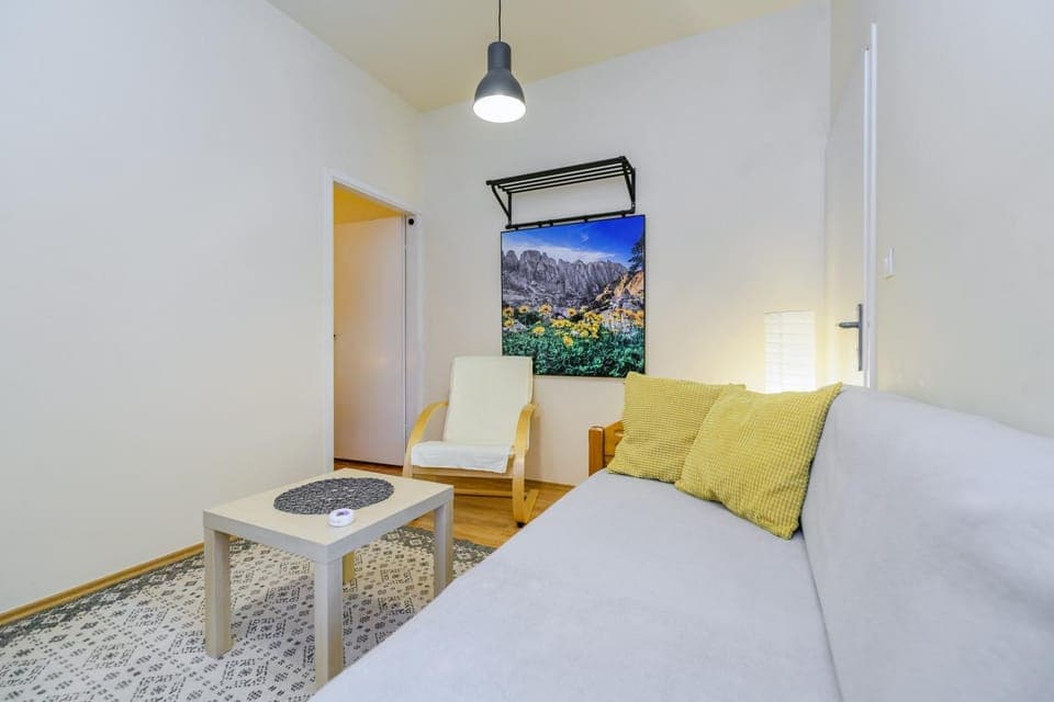 Bed, TV and multimedia, Living room, Seating area, air conditioner