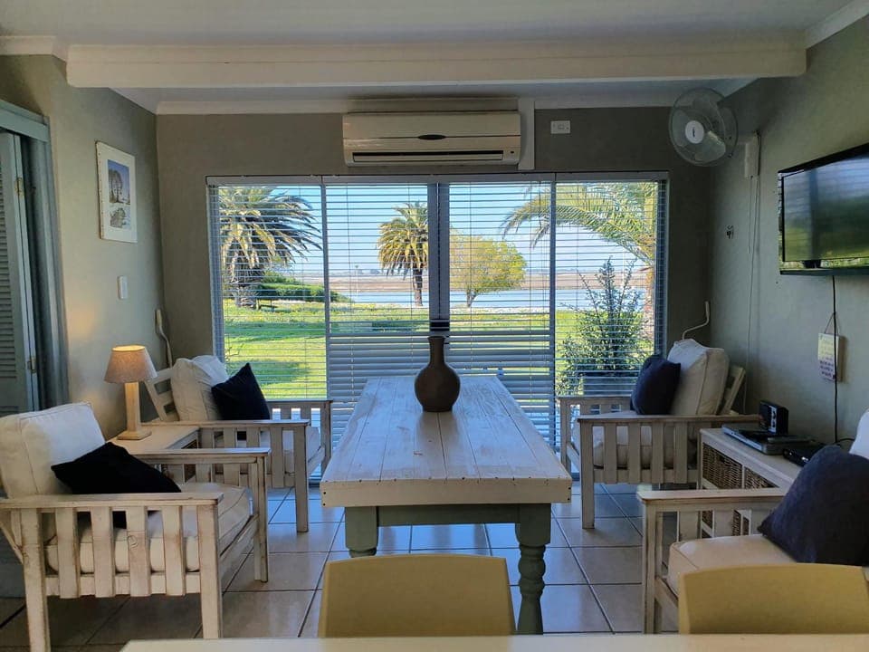 Living room, Seating area, Dining area, River view