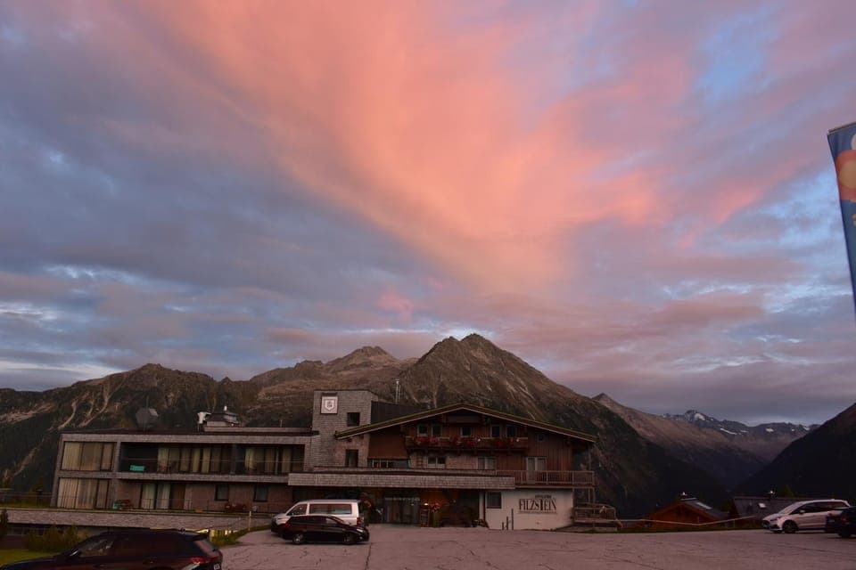 Property building, Natural landscape, Mountain view, Sunset, Parking
