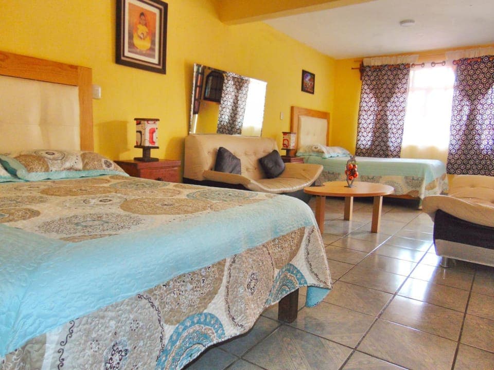 Bed, Living room, Seating area, Bedroom