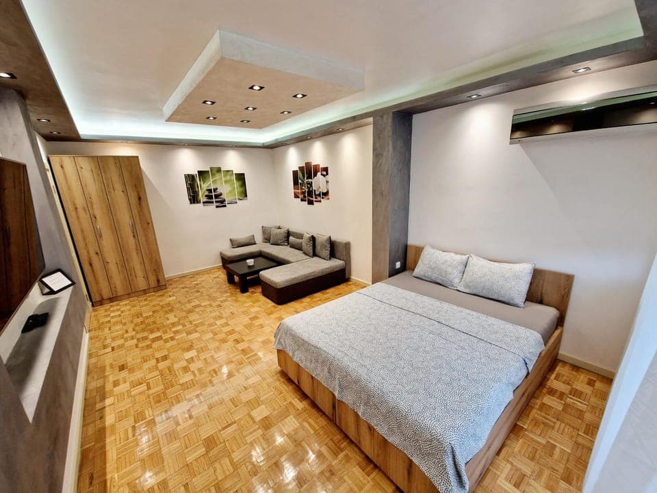 Bed, TV and multimedia, Living room, Seating area, wardrobe