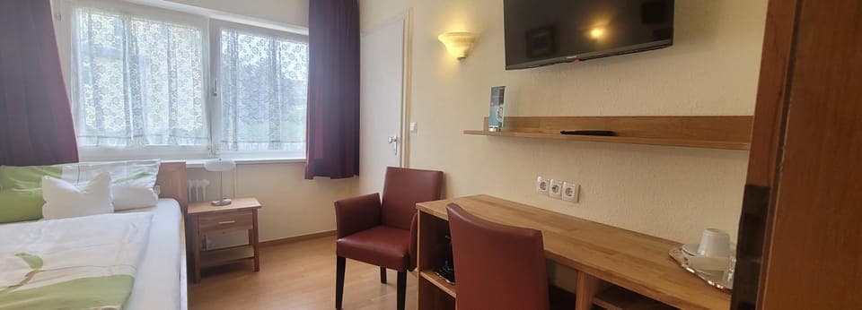 Bed, TV and multimedia, Seating area, Bedroom, hair dresser