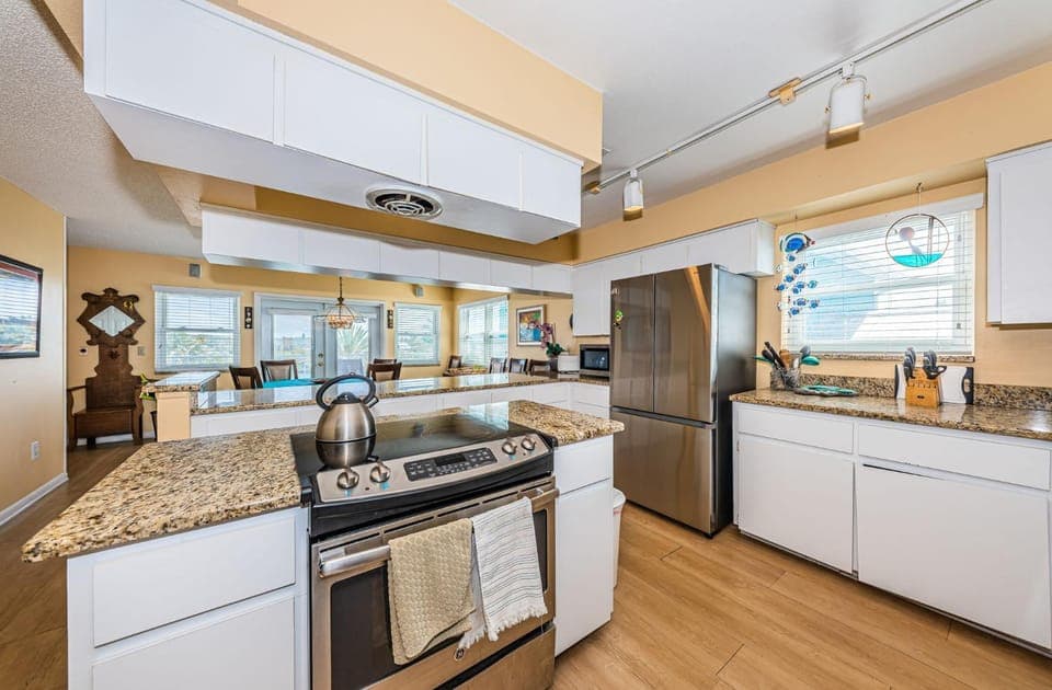 Kitchen or kitchenette, dishwasher, oven, stove