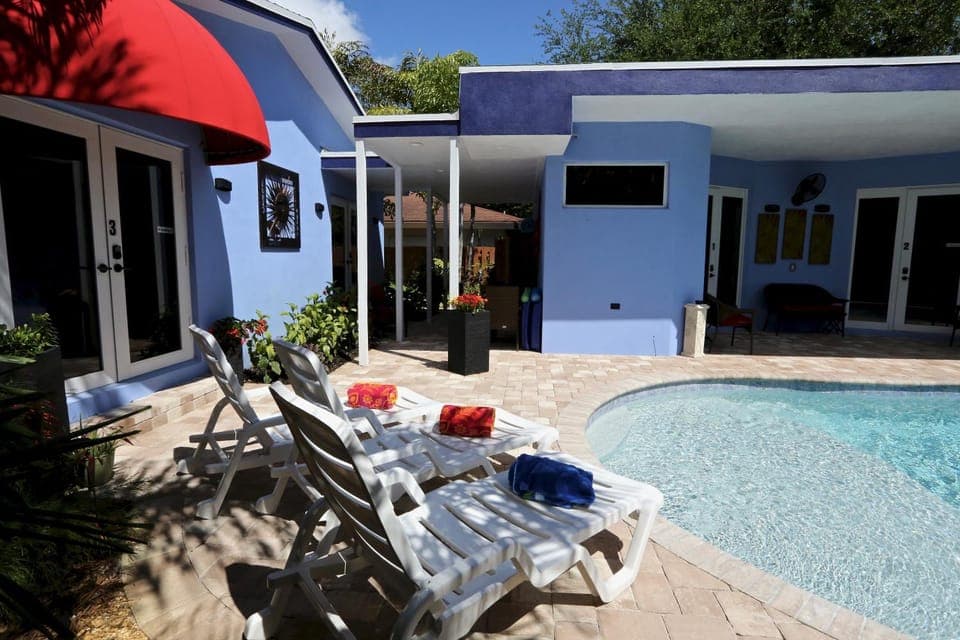 Property building, Patio, Pool view, Swimming pool, sunbed