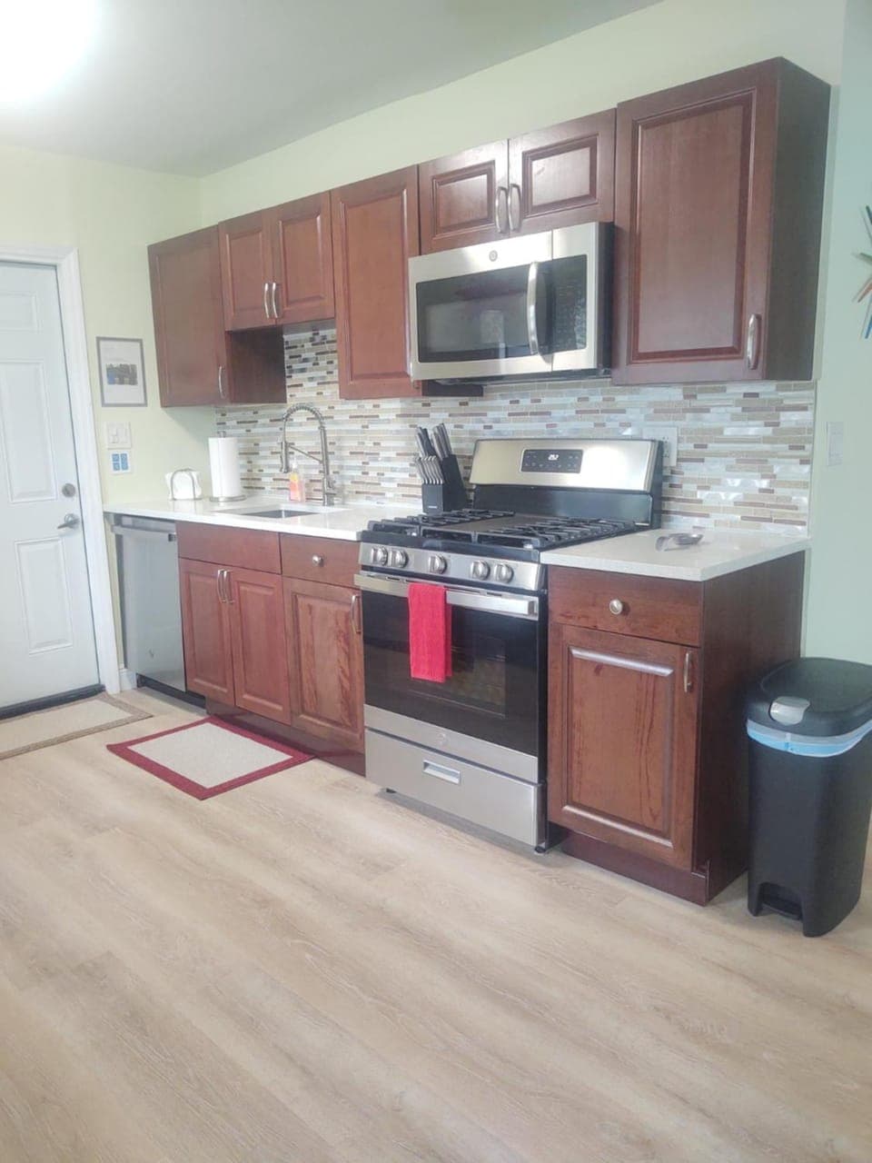 Kitchen or kitchenette, dishwasher, oven, stove