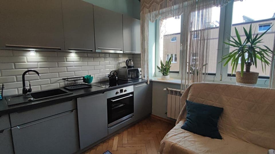 Coffee/tea facilities, Kitchen or kitchenette, Living room, Seating area, Dining area, City view, dishwasher, stove, toaster