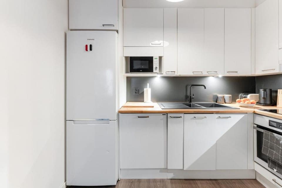 Kitchen or kitchenette, dishwasher, oven, stove, toaster