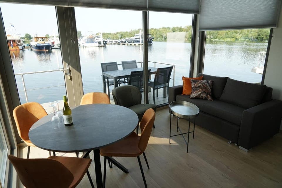 View (from property/room), Living room, Seating area, Dining area, Lake view