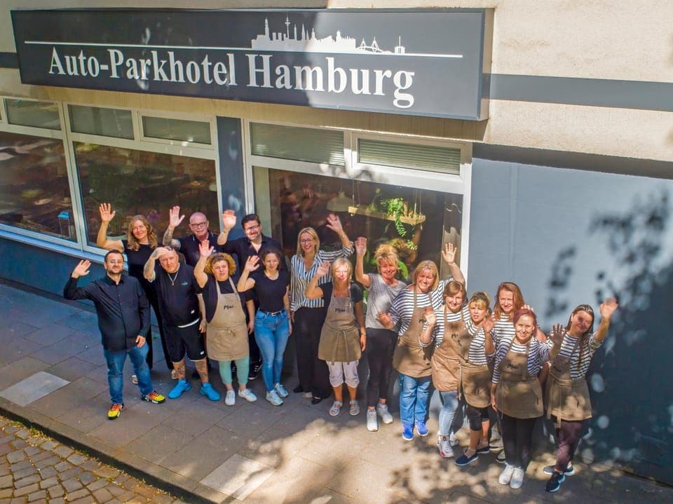 Property building, Staff, Facade/entrance, People, Property logo or sign, Bird's eye view