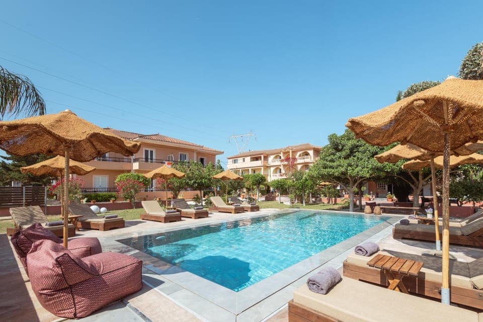 Property building, Day, Pool view, Swimming pool, sunbed