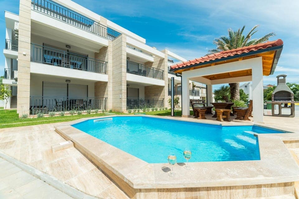 Property building, Patio, Day, Pool view, Swimming pool