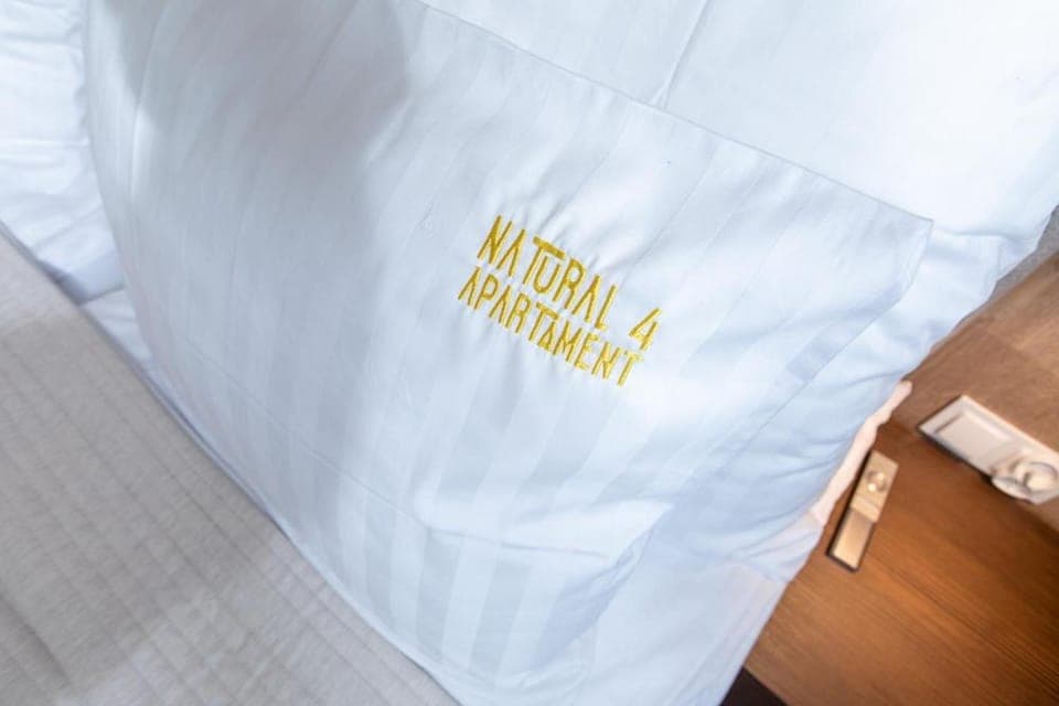 Bed, Property logo or sign, Photo of the whole room, Logo/Certificate/Sign, Bedroom, towels