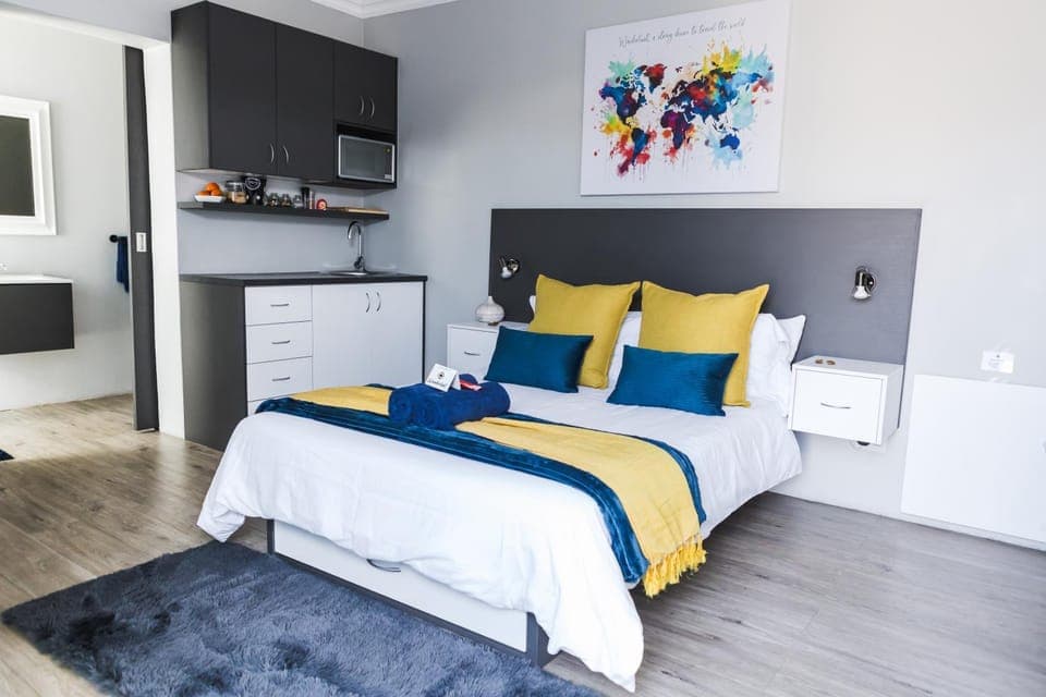 Bed, Decorative detail, Bedroom, microwave, towels, wardrobe