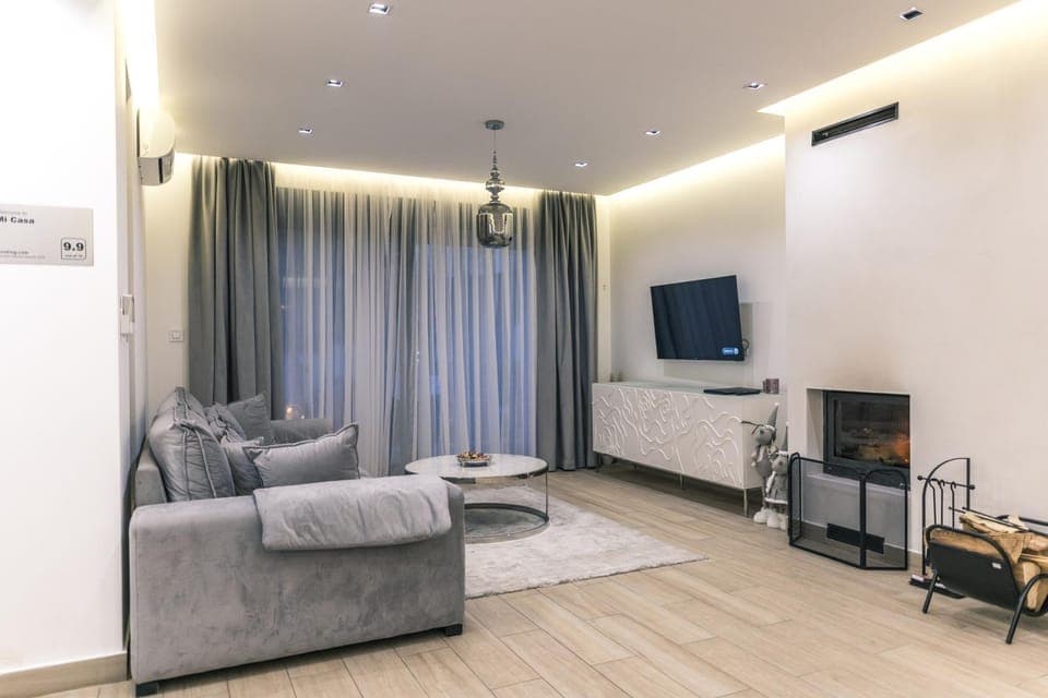 TV and multimedia, Living room, Seating area, fireplace, air conditioner