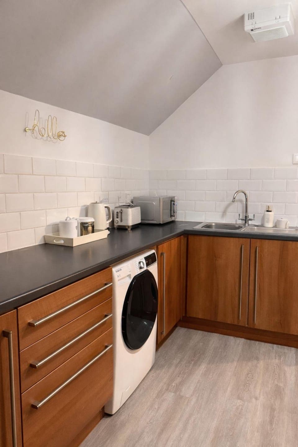 Kitchen or kitchenette, dishwasher, stove, washing machine