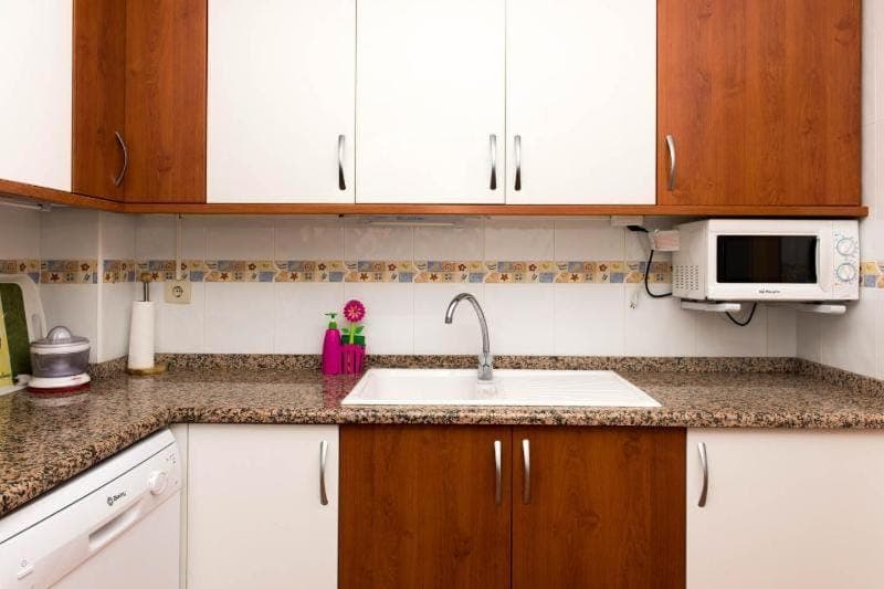 Kitchen or kitchenette, dishwasher, microwave, oven, stove, toaster