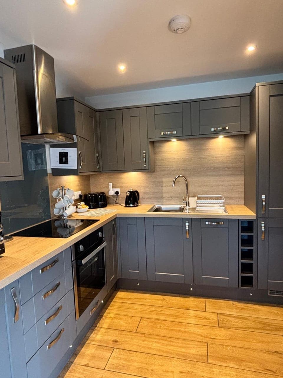 Kitchen or kitchenette, dishwasher, oven, stove, toaster