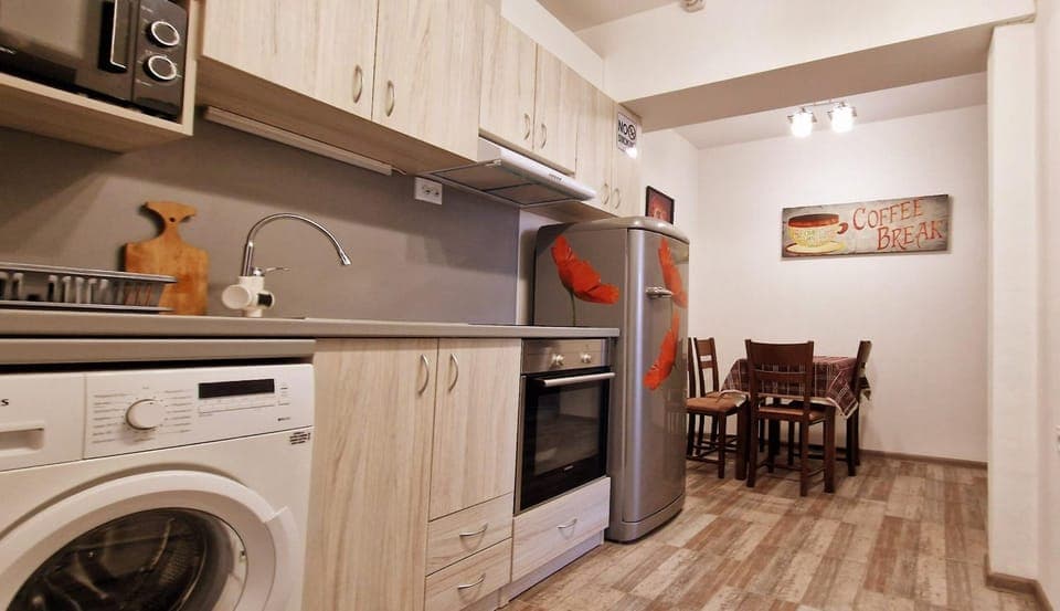 Kitchen or kitchenette, Dining area, microwave, oven, stove, washing machine