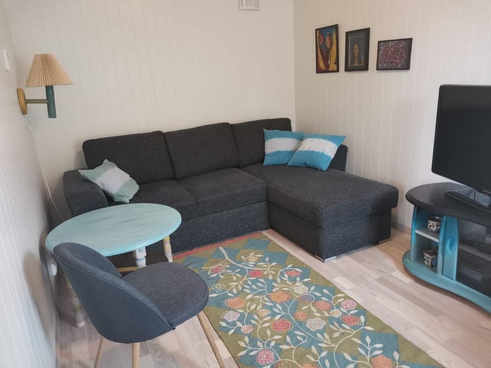 Bed, TV and multimedia, Seating area, Bedroom, Sea view