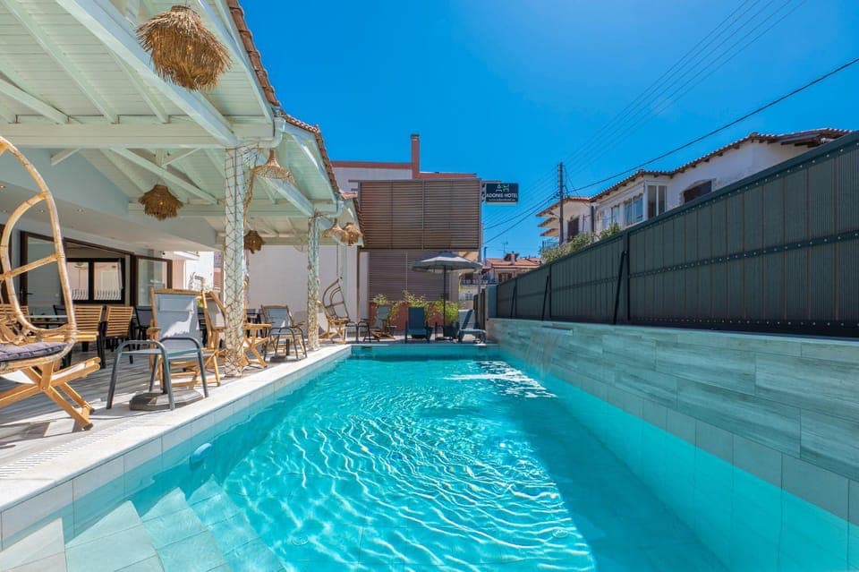 Property building, Patio, Day, View (from property/room), Pool view, Swimming pool, sunbed