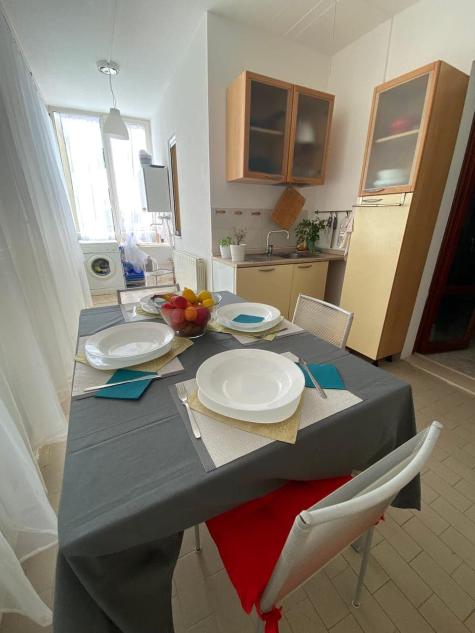 Kitchen or kitchenette, washing machine