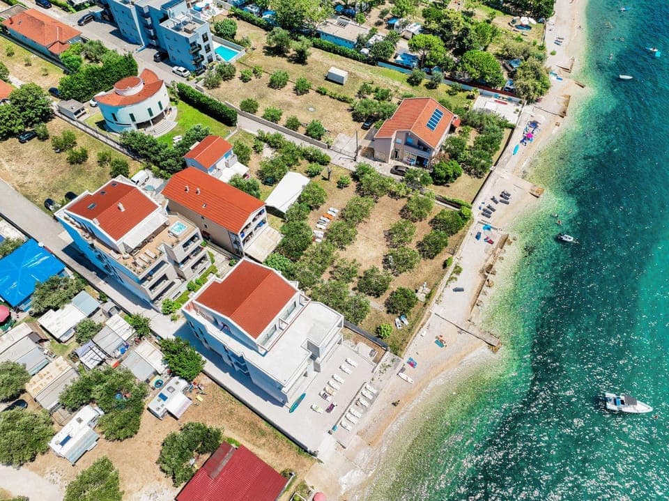 Property building, Nearby landmark, Natural landscape, Beach