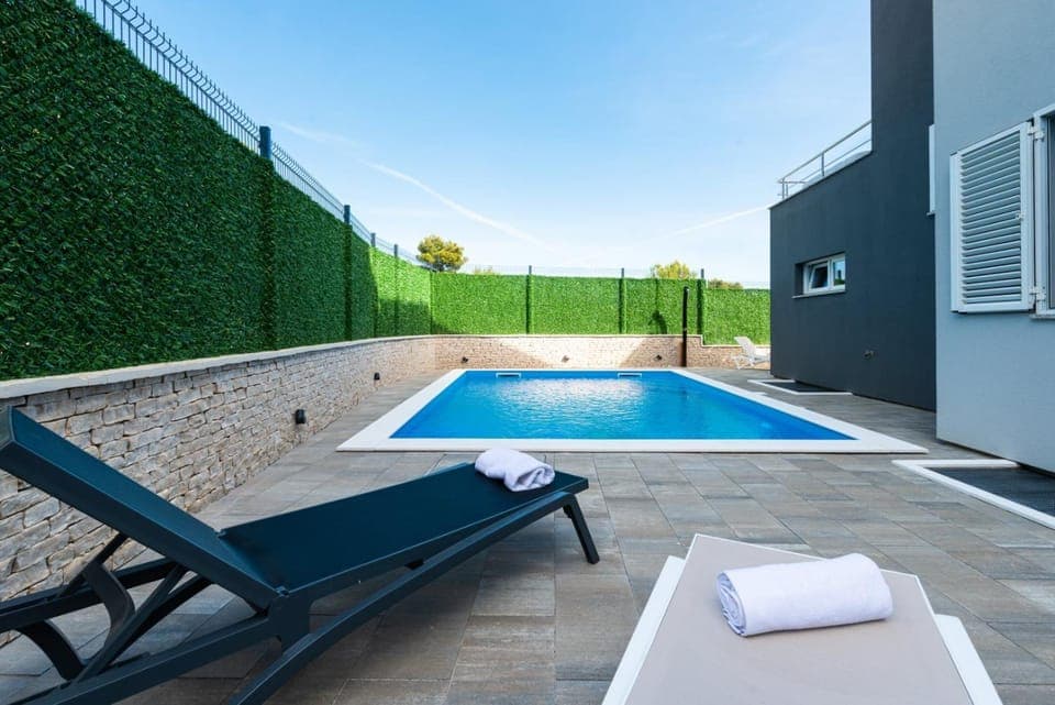 Patio, Day, Pool view, Swimming pool, sunbed, towels