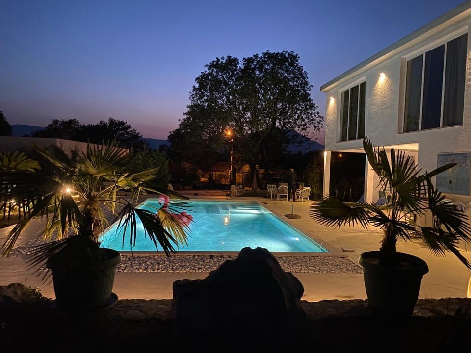 Property building, Patio, Night, Natural landscape, Garden, Garden view, Pool view, Swimming pool, sunbed