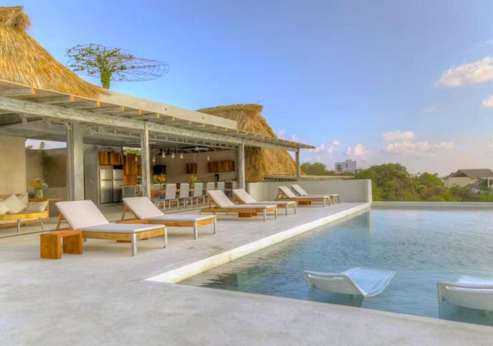 Property building, Patio, Day, Natural landscape, Pool view, Swimming pool, Swimming pool, sunbed