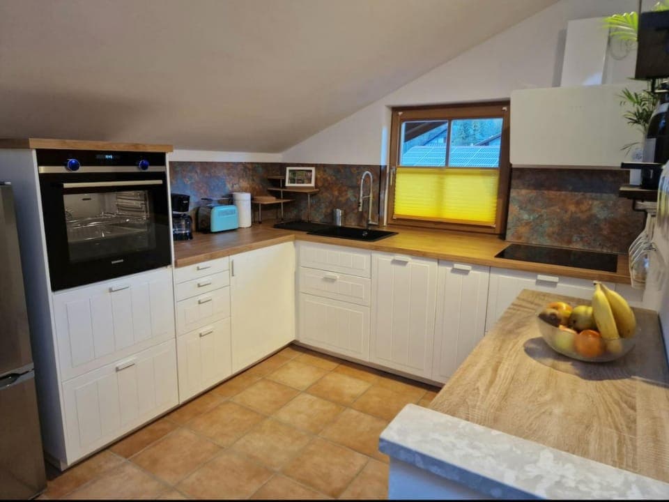 Kitchen or kitchenette, dishwasher, oven, stove