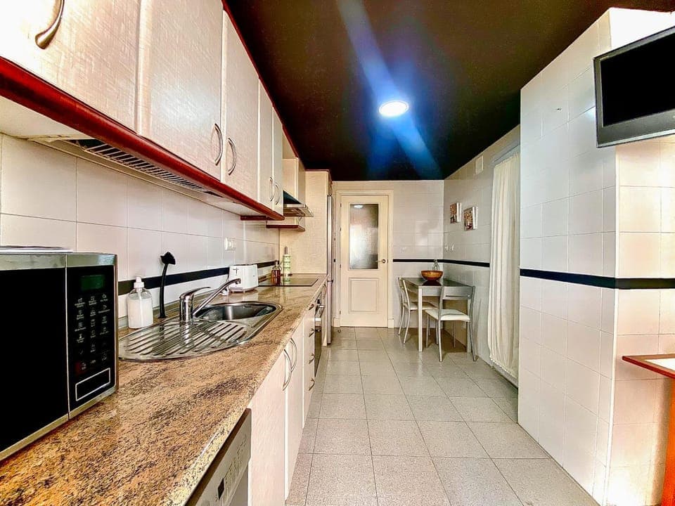 Kitchen or kitchenette, dishwasher, oven, stove