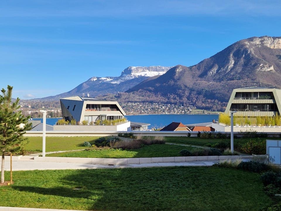 Property building, Nearby landmark, Day, Natural landscape, Lake view, Mountain view