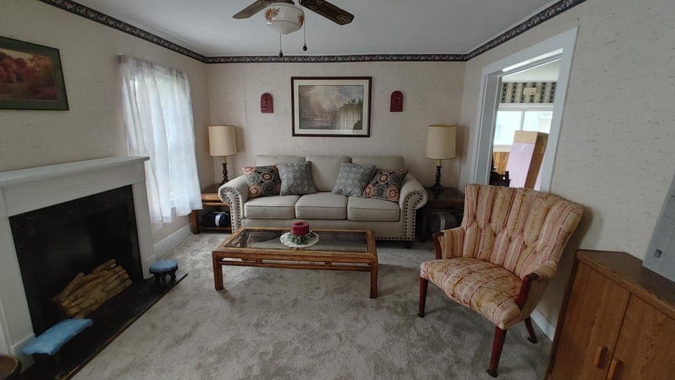 Living room, Seating area, fireplace, flat iron