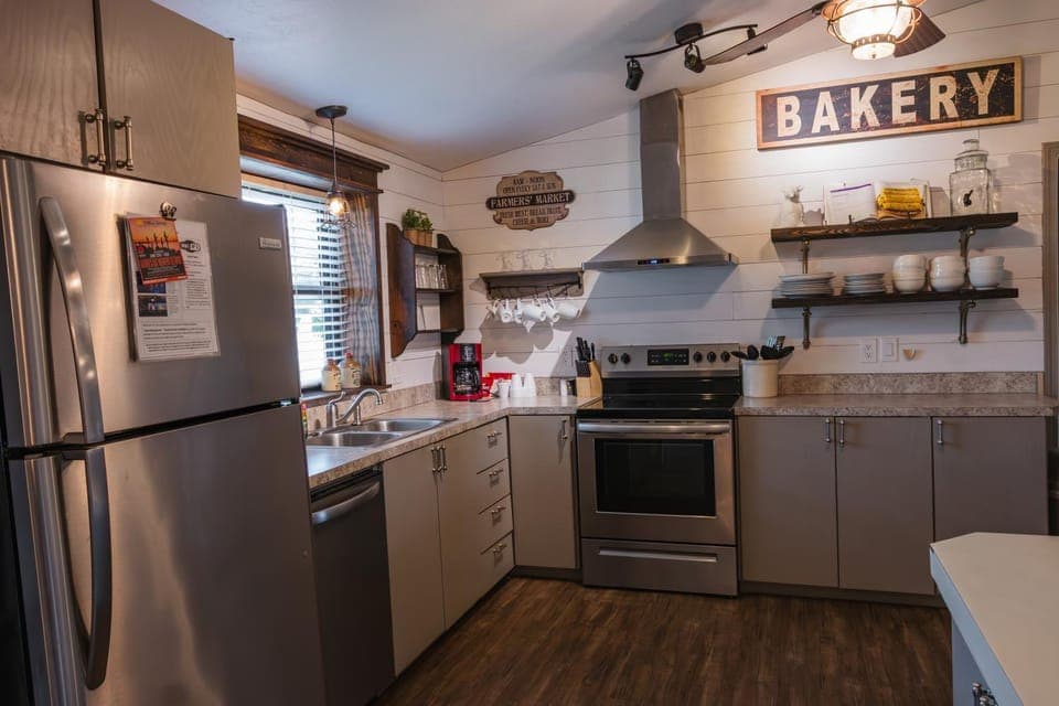 Kitchen or kitchenette, dishwasher, oven, stove